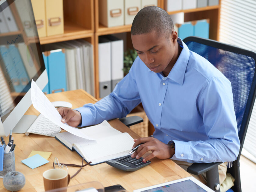 Businessman concentrated on work with financial document